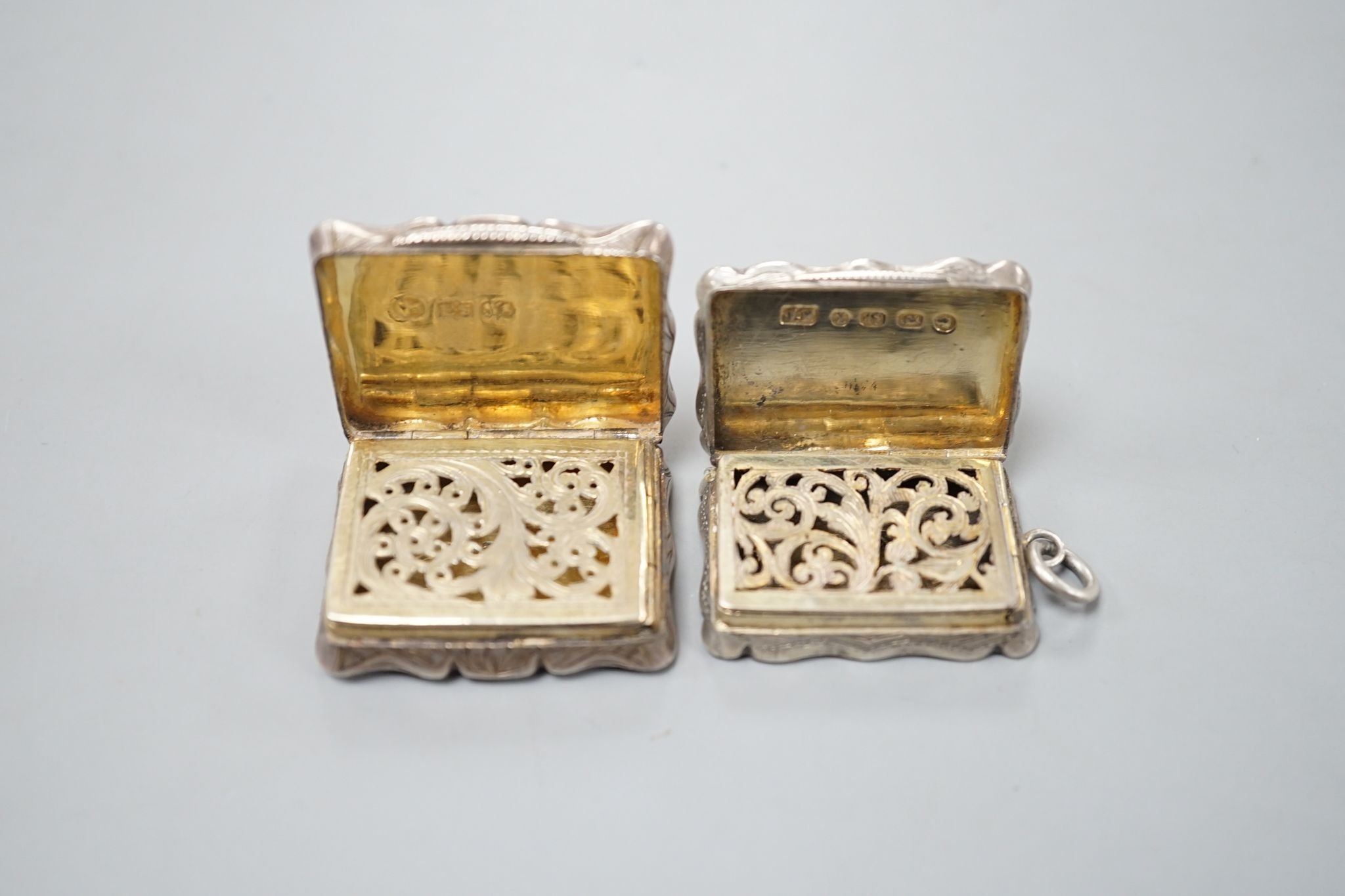 An early Victorian engraved silver vinaigrette inscribed 'Jenny McDonald' Edward Smith, Birmingham, 1845, 34mm and a later silver vinaigrette.